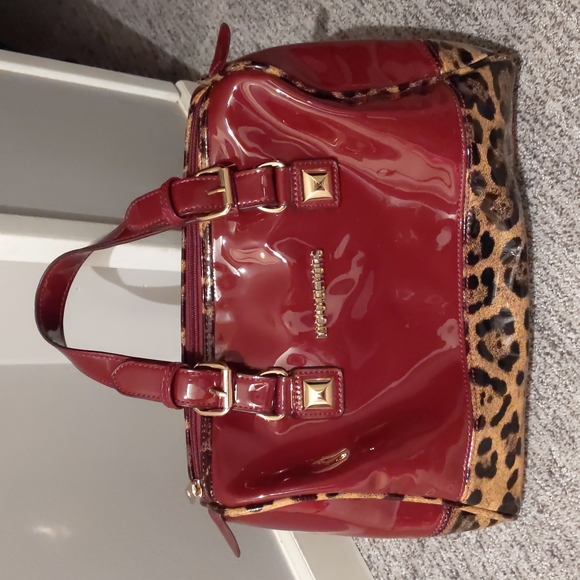 Michael Kors Handbags - Michael Kors burnt red with cheetah print. Patent leather look.